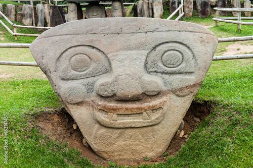 Ancient statues in archeological park in San Agustin, Colombia photo
