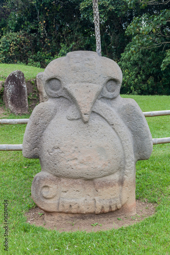 Ancient statue in archeological park in San Agustin, Colombia photo