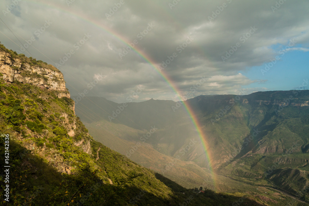 Rainbow in Chicamocha river canyon in Colombia Rainbow in Chicamocha river canyon in Colombia