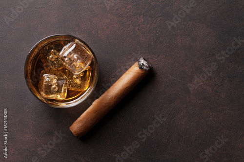Whiskey with ice and cigar