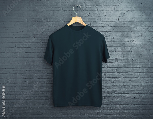 Black t-shirt on brick background