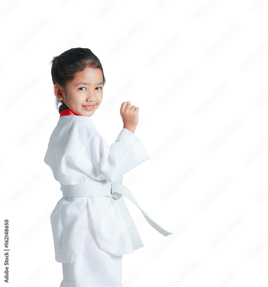 Happy Asian little girl is smile and showing fist for guarding in taekwondo uniform isolated on white background Happy Asian little girl is smile and showing fist for guarding in taekwondo uniform isolated on white background
