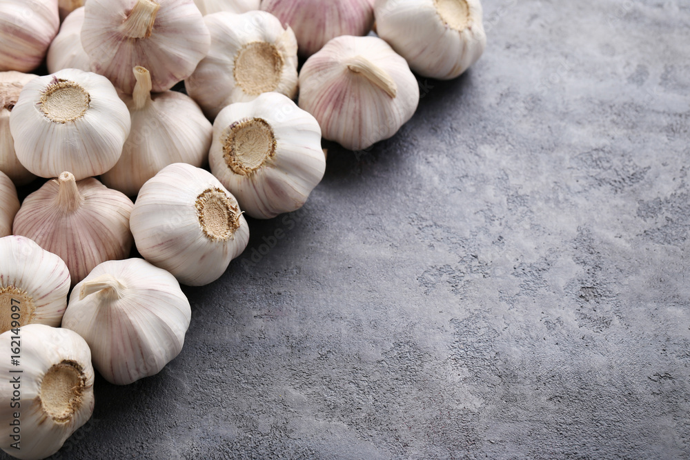 Garlic on the grey wooden table Garlic on the grey wooden table