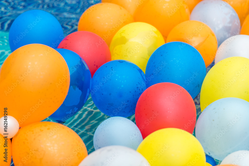 balloons in a pool balloons in a pool