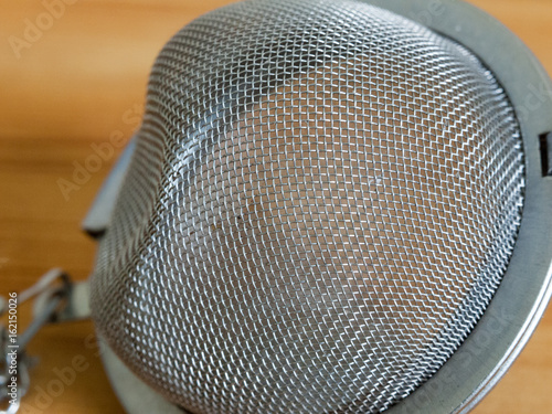 Metal tea strainer isolated in full detail