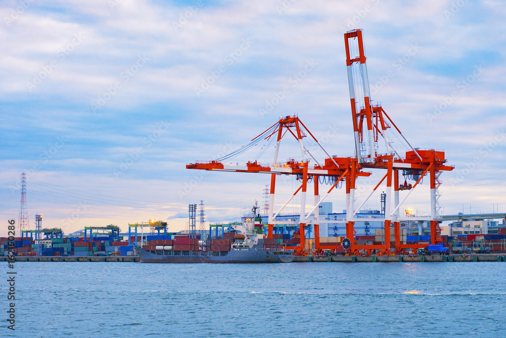 Fototapeta premium Commercial delivery cargo container ship at Osaka harbor bay , Japan in logistics and transportation concept