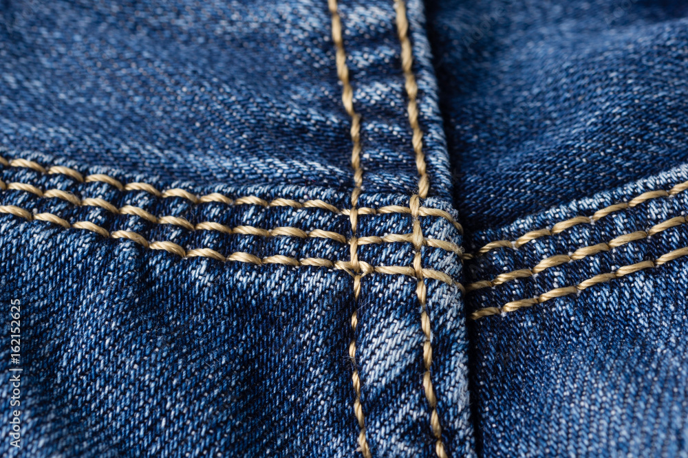 Jeans close-up. Seams. Interlacing the fabric with a close-up Jeans close-up. Seams. Interlacing the fabric with a close-up