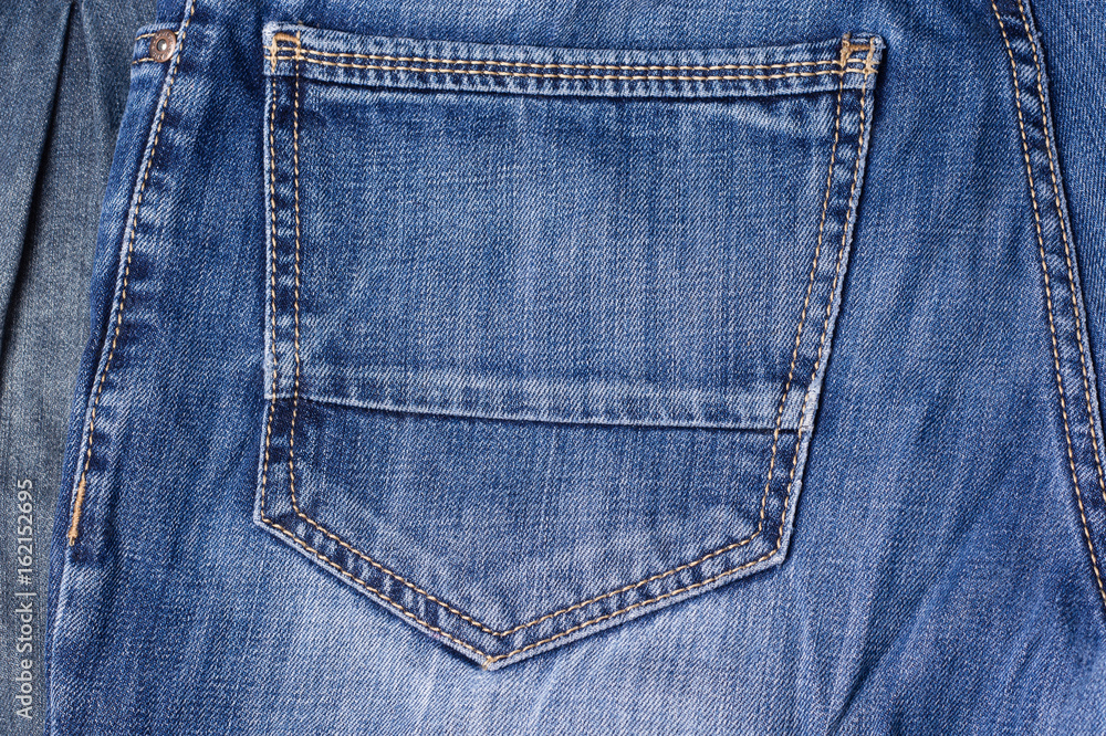 Jeans close-up. Pocket, seams. Interlacing the fabric with a close-up Jeans close-up. Pocket, seams. Interlacing the fabric with a close-up