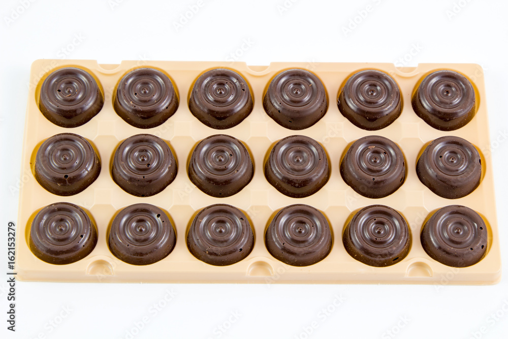 Chocolates box isolated on white background. / Chocolate in a gift box isolated on white. Chocolates box isolated on white background. / Chocolate in a gift box isolated on white.