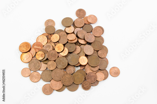 Pile of euro coins money isolated white background. / Many of small euro gold coins for design and background.