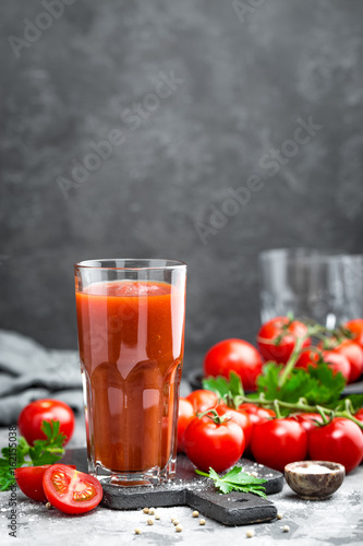 Tomato juice and fresh tomatoes photo