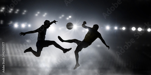 Silhouettes of two soccer players . Mixed media © Sergey Nivens