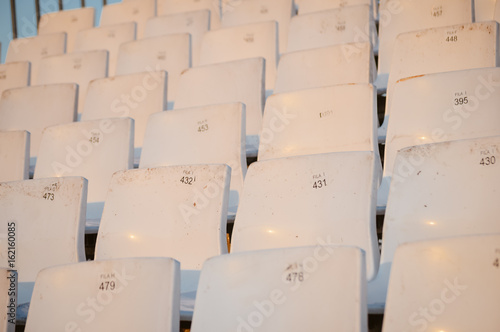 Rows of empty chairs abstract event background