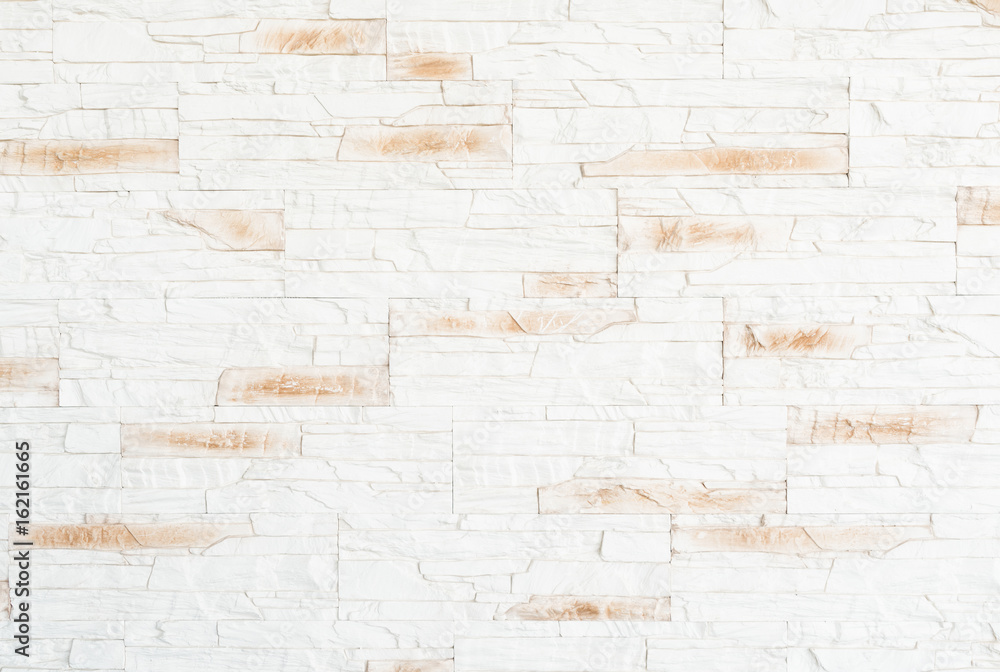 textured surface of white and beige brick wall background textured surface of white and beige brick wall background