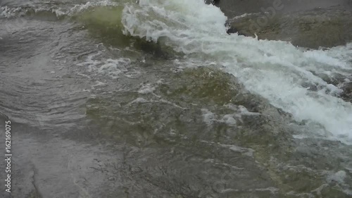 rapids river stream inlets on boulders. photo