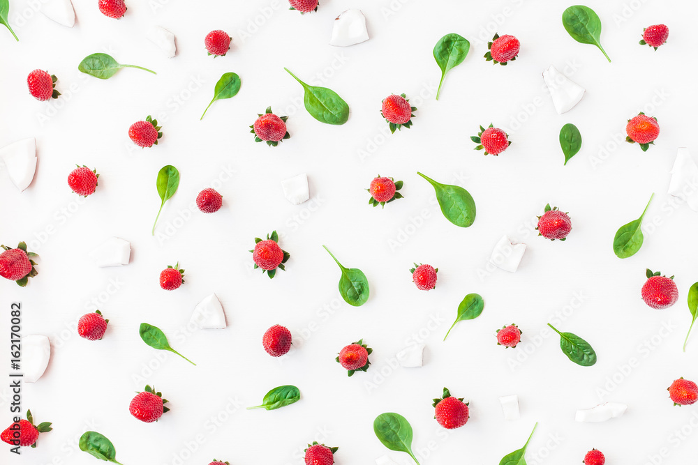 Fresh strawberry and coconut on white background. Fruit pattern. Summer concept. Flat lay, top view Fresh strawberry and coconut on white background. Fruit pattern. Summer concept. Flat lay, top view