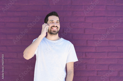 Latin man talking on the phone