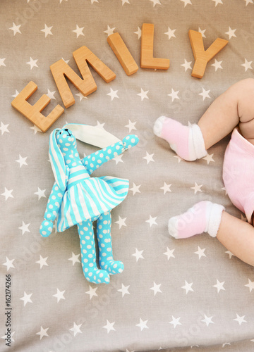 Legs of cute baby, toy and ...