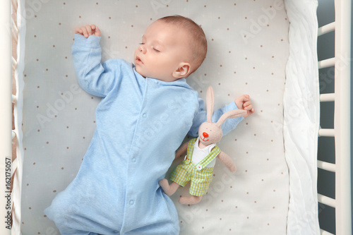Cute little baby with toy s...