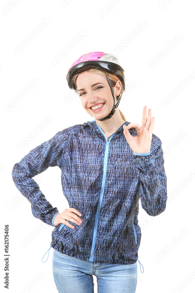 Fototapeta premium Beautiful young bicycle rider with helmet on white background