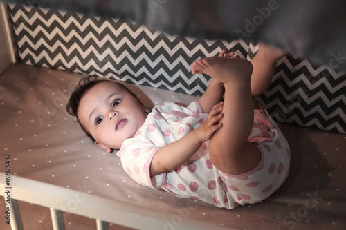 Εκτύπωση καμβά Cute little baby lying in cradle at home. Sleep disorders concept