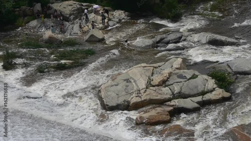 Torrential waterfall & spray cover stone,Mountain Tai-shan. Torrential waterfall & spray cover stone,Mountain Tai-shan.