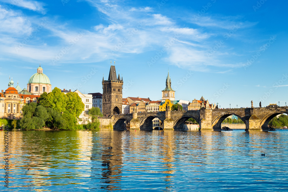 Fototapeta premium View of Charles Bridge and Lesser Bridge Tower in Prague, Czech Republic