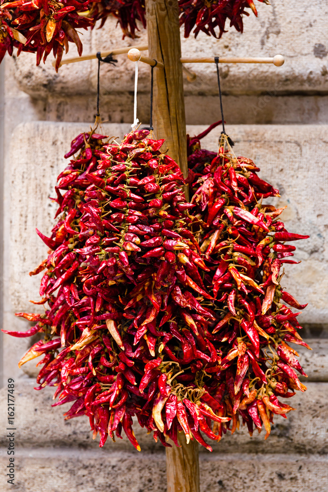 Dried hot traditional Hungarian paprika pepper hanging in bunch 