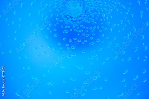 Air bubbles in blue water