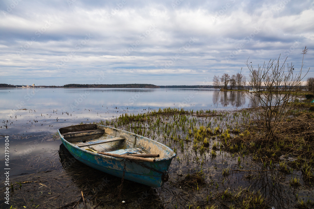 A boat on the river bank