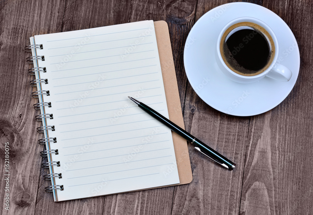 Empty notepad with coffee on table Empty notepad with coffee on table