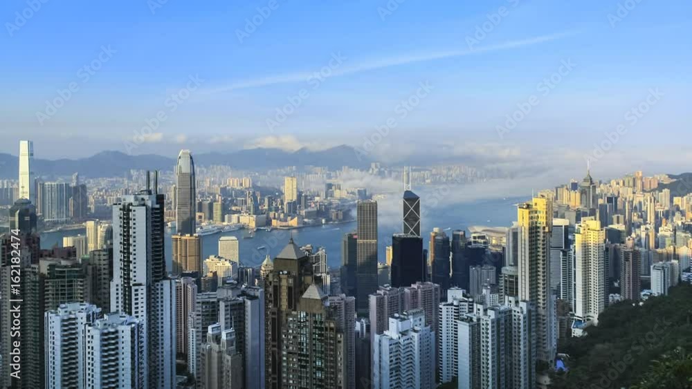 Time lapse Hong Kong skyline from famous Peak View at night. Fog rushing into the city. Time lapse Hong Kong skyline from famous Peak View at night. Fog rushing into the city.