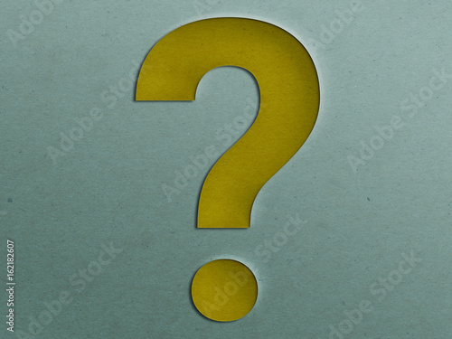 Paper Cut Question Mark on the Grunge Paper