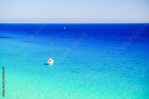 White boat in the ocean on Fuerteventura, Spain.