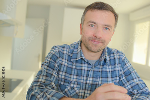 mature man looking around vacant new property