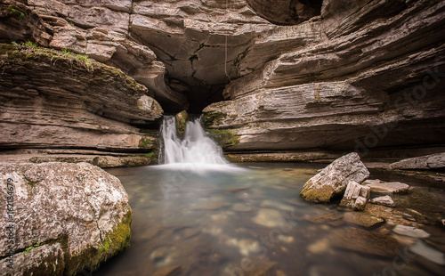 Waterfall flowing from cave