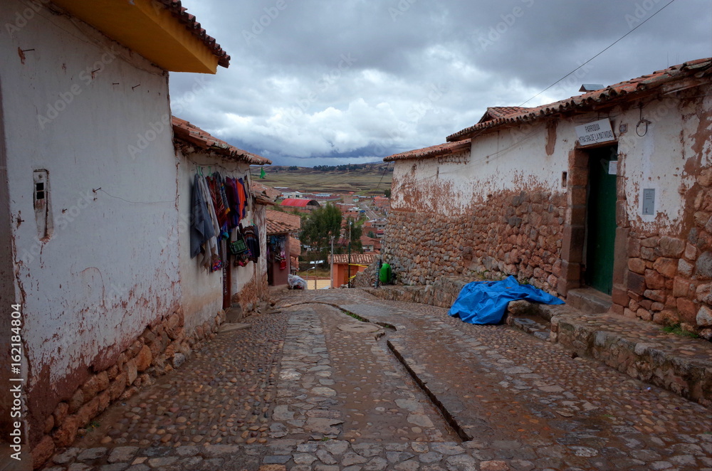 A street with mud brick houses in Chinchero