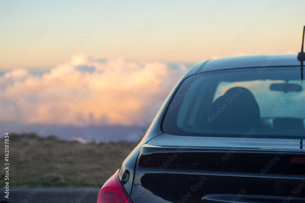 Black car above the clouds