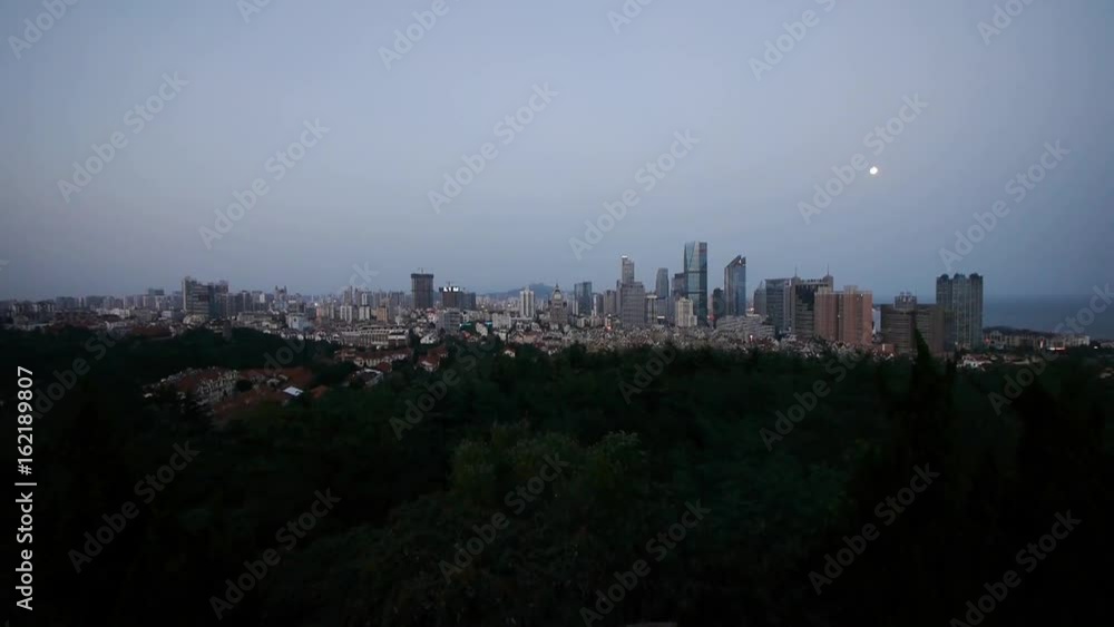 Time lapse of moon rising over urban skyline,day to night. Time lapse of moon rising over urban skyline,day to night.