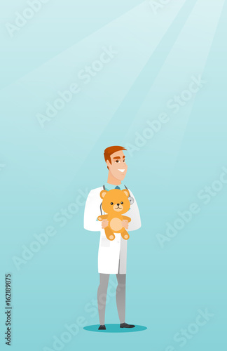 Pediatrician doctor holding teddy bear.