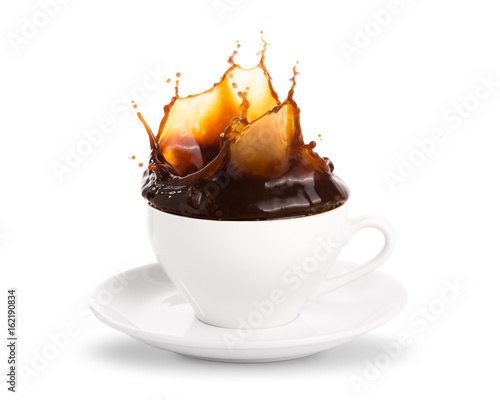 Pouring coffee into coffee cup with splashing., Isolated on white background.
