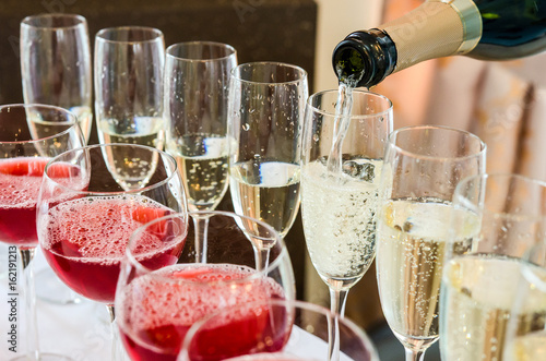 Bartender pouring champagne into glass