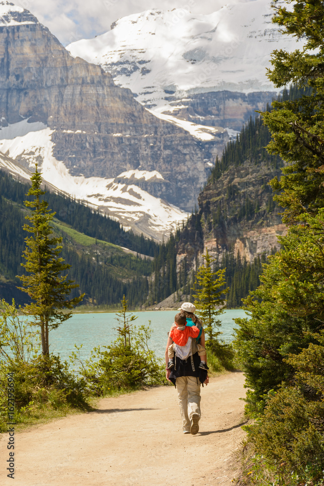 Mother and son hiking around Lake Louise in Summer