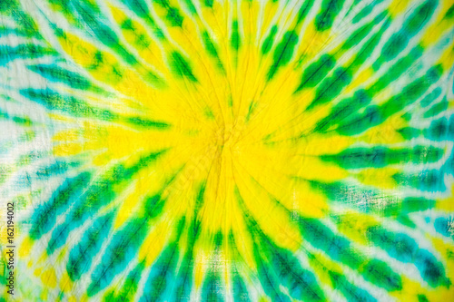 colourful tie dyed pattern on cotton fabric for background.