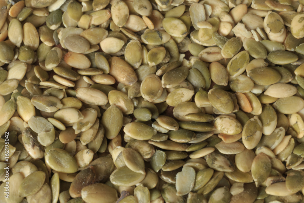 Vegan food. Raw pumpkin seeds for roasting closeup Vegan food. Raw pumpkin seeds for roasting closeup