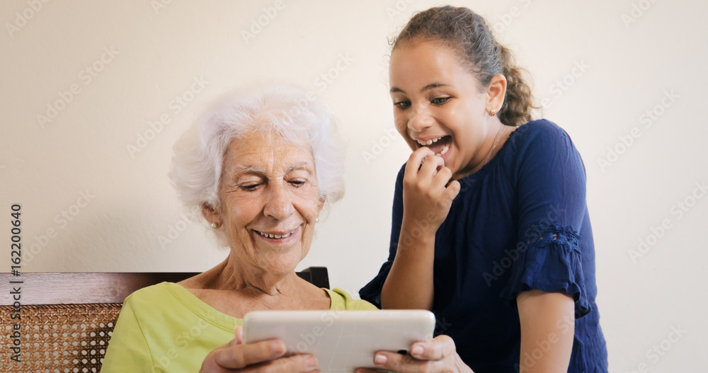 Senior Woman And Grandchild With Tablet Computer For Internet Senior Woman And Grandchild With Tablet Computer For Internet