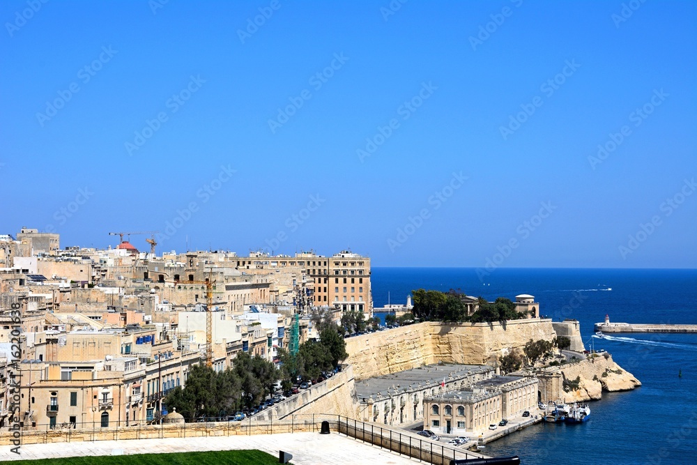 Elevated view of city buildings on the East side of the grand harbour, Valletta, Malta.
