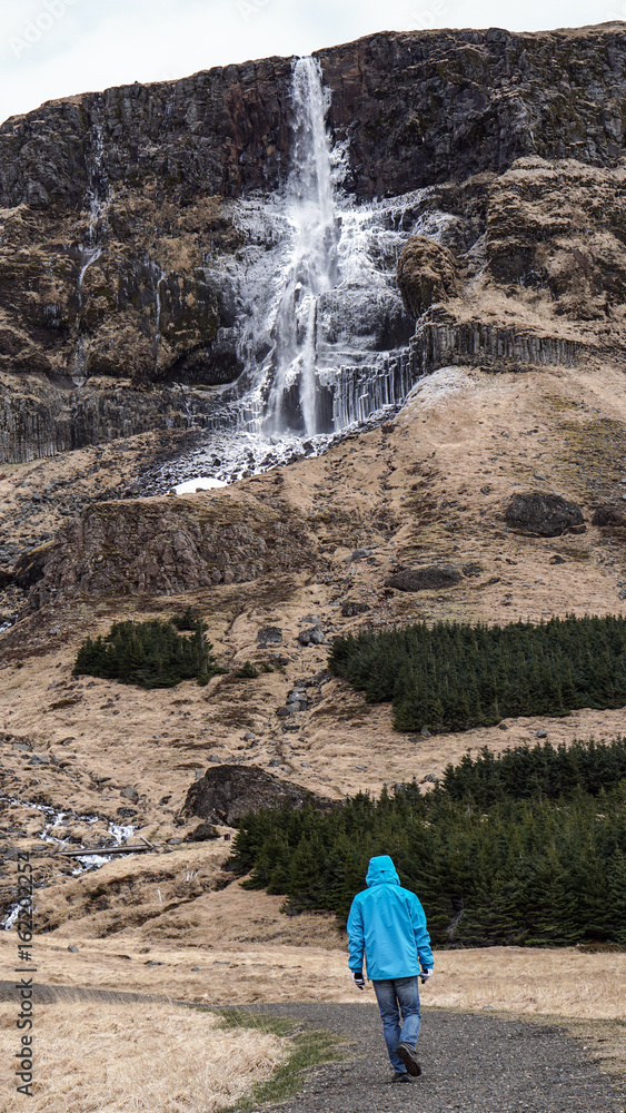 Advature man human scale with majestic waterfall mountain size. Wonderful world of nature