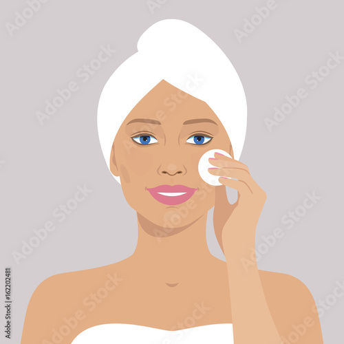 Beautiful woman with cotton pad