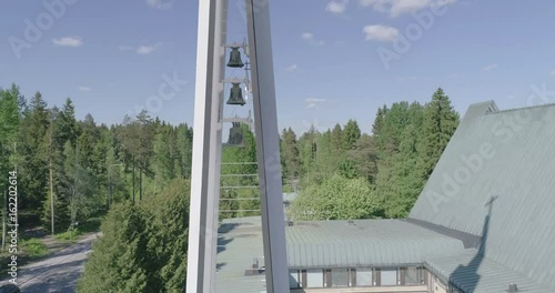 Midday aerial view of Christian cross in Lahti, Finland, point of intrest and spiral up movement